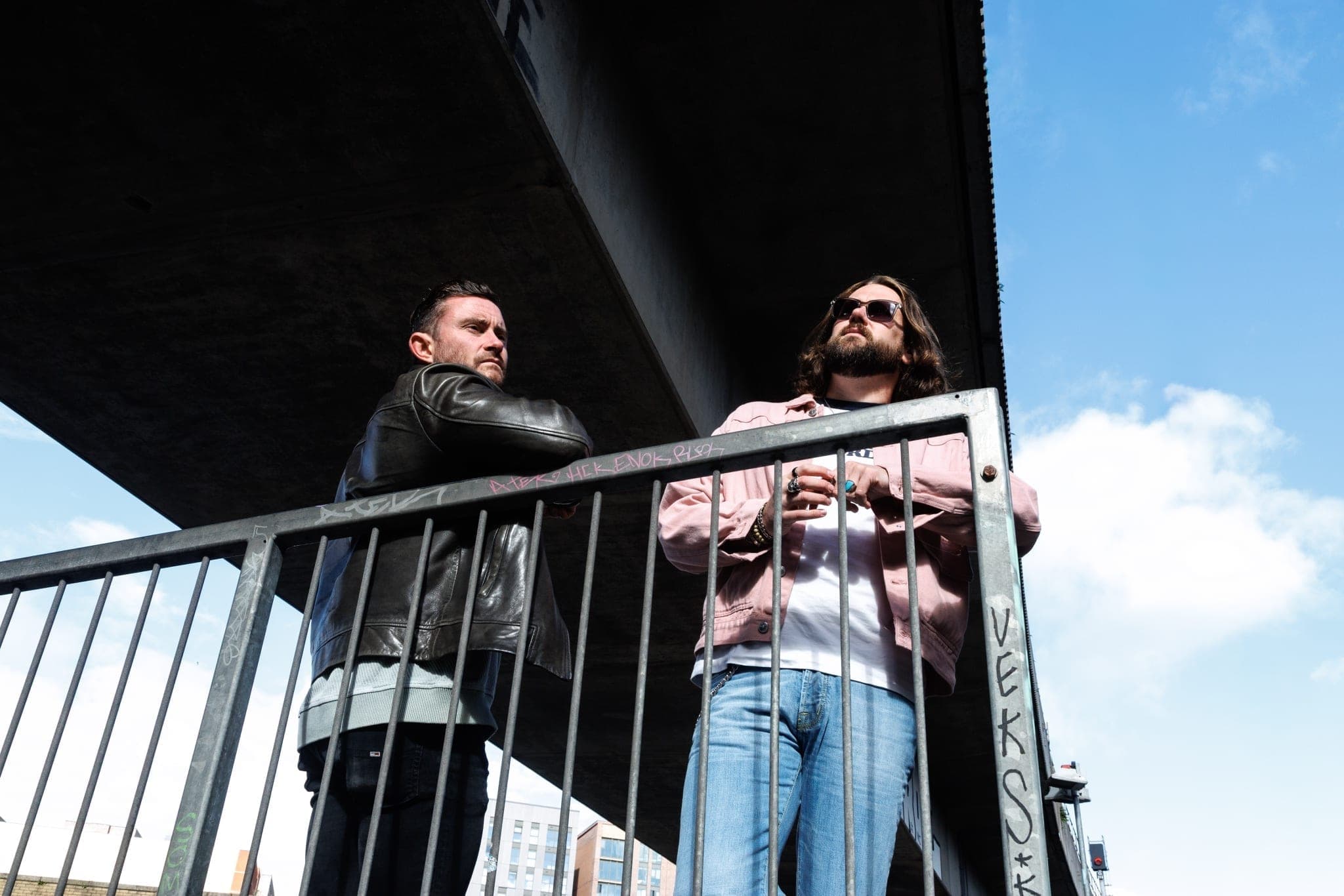 Phill Hendry and Martin Irvine, co-founders of Of One Creative — editorial portrait outside the Belfast studio, a personal brand studio for founders