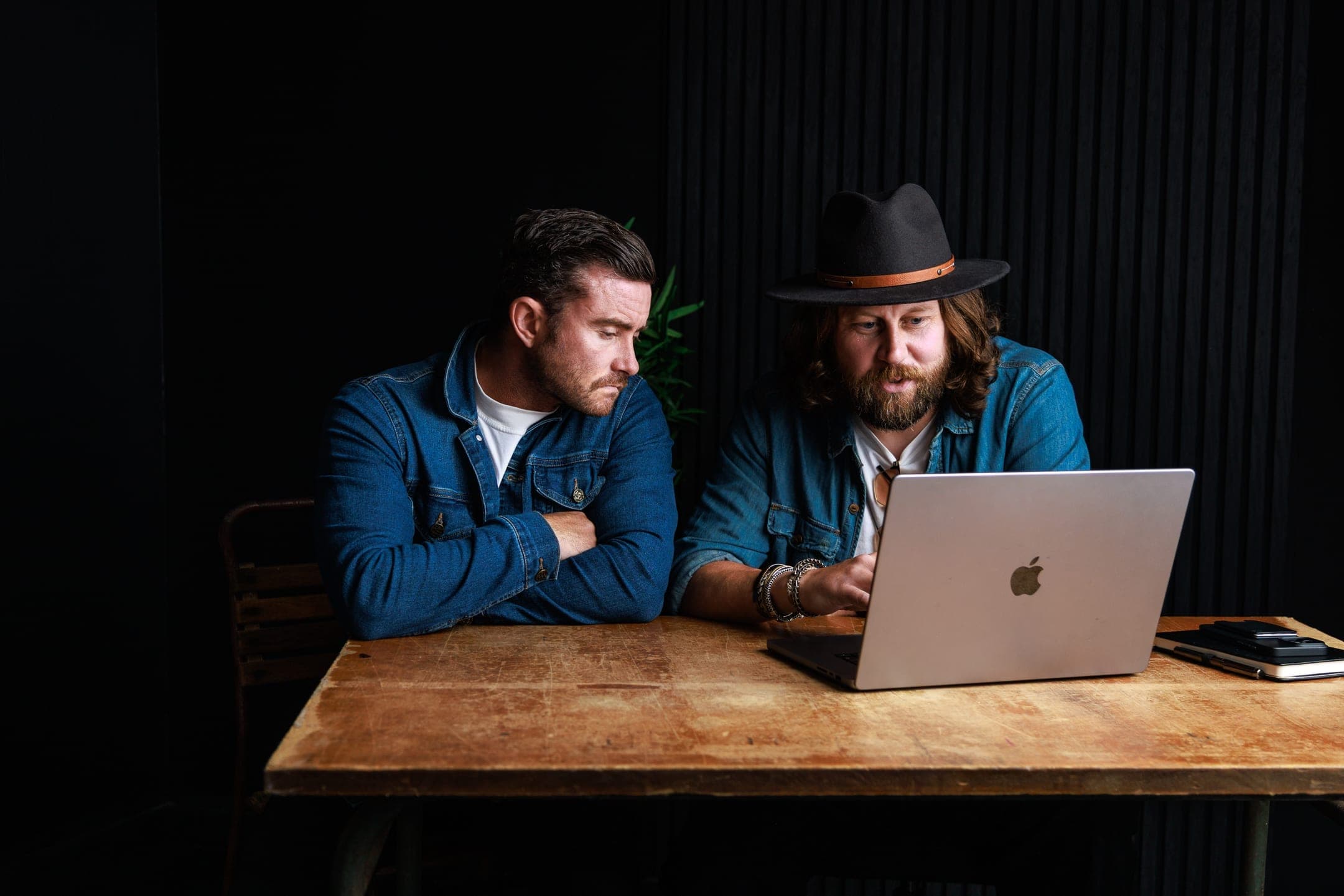 Phill Hendry and Martin Irvine working on consultant brand positioning at Of One Creative — Belfast personal brand studio