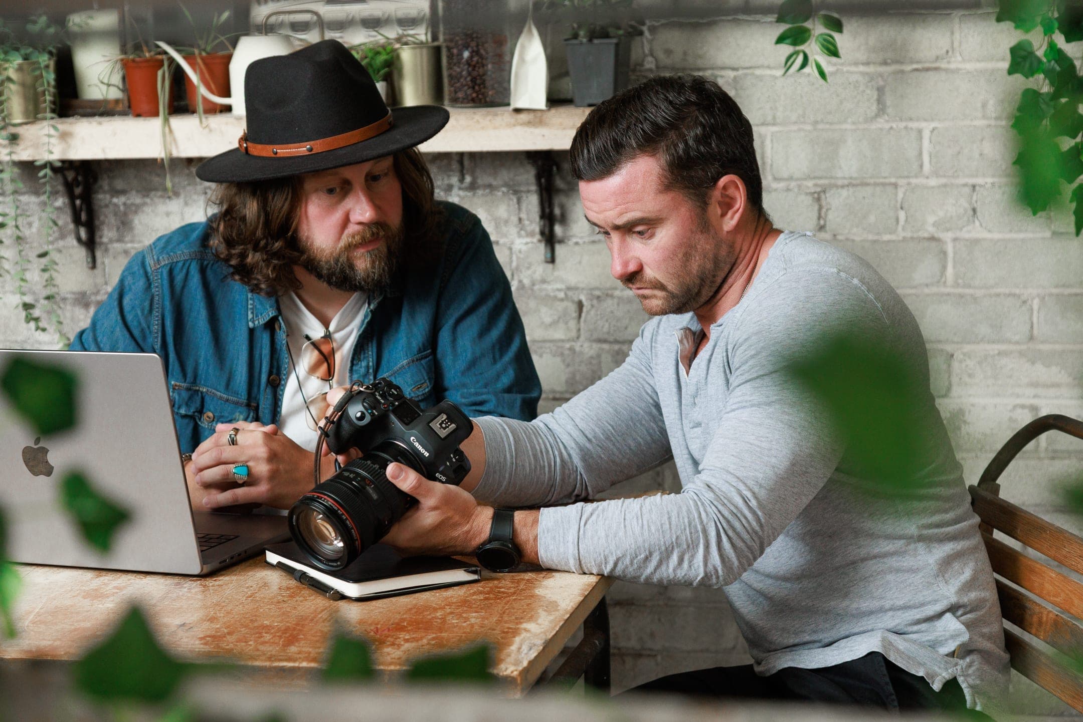 Phill Hendry and Martin Irvine reviewing brand photography for a coaching client — Of One Creative editorial photoshoot